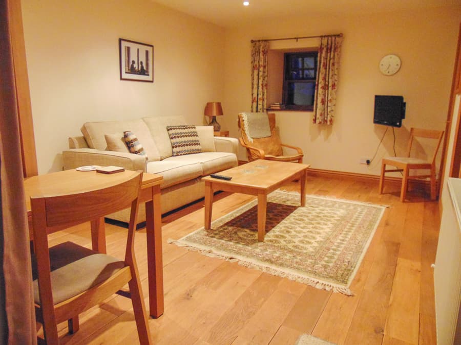 Apartment sitting room with dining area at Perthshire Courtyard